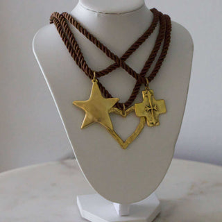 Silk Cord Pendant Necklace with brown twisted cords and gold-toned star, heart outline, and cross pendants
