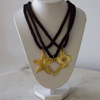 Silk Cord Pendant Necklace with three dark twisted cords and gold-tone star, heart and cross pendants