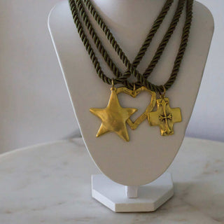Silk Cord Pendant Necklace with dark twisted cords and gold-tone star, heart, and cross pendants