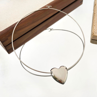 Silver Heart Choker Necklace with a polished silver-tone rigid wire band and a large smooth heart pendant