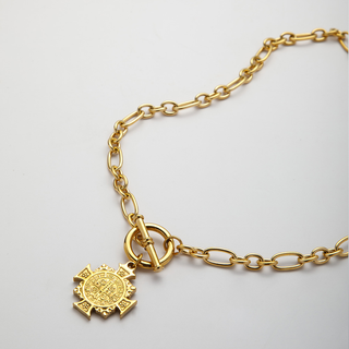 St Benedict Toggle Necklace in gold-tone metal with oval chain links, toggle clasp and detailed round medallion