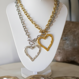 Sweetheart Toggle Necklace featuring gold and silver-tone chains with open heart pendants and toggle clasps