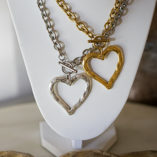 Sweetheart Toggle Necklace with two open heart pendants in gold and silver tone, chunky chains and toggle clasps