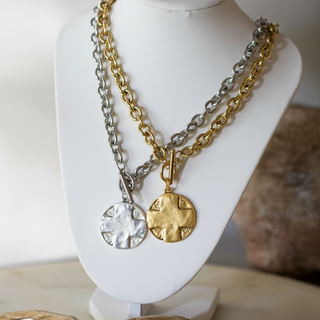 The Lord's Prayer Cross Medallion necklace in gold and silver tones, featuring round hammered cross pendants and chunky chains