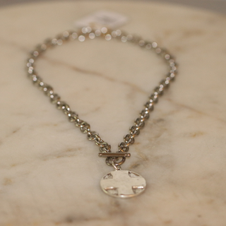 The Lord's Prayer Cross Medallion necklace in silver-tone metal, with a round cross pendant and toggle clasp