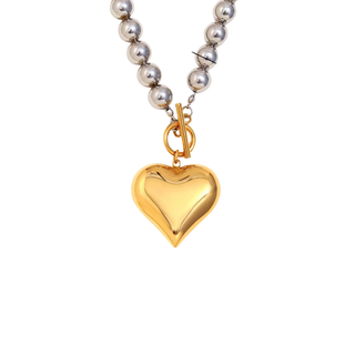 Two-Tone Heart Necklace with a polished gold heart pendant and shiny silver-tone spherical chain with a gold clasp