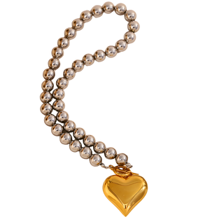Two-Tone Heart Necklace with a glossy gold heart pendant and polished silver-tone spherical beads along the chain