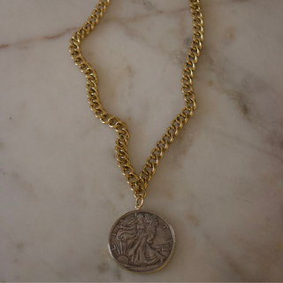 Two-Tone Liberty Coin Necklace with a chunky gold-tone chain and round silver-tone coin pendant edged in gold