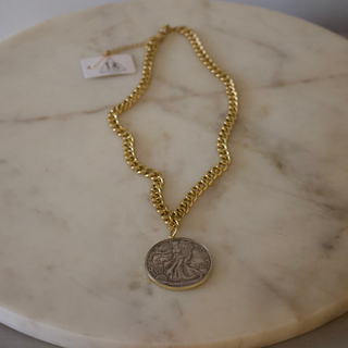 Two-Tone Liberty Coin Necklace with a gold-tone chunky chain and round silver-toned coin pendant with an engraved figure