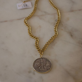 Two-Tone Liberty Coin Necklace with a chunky gold-tone chain and round silver-colored coin pendant with a gold rim