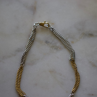 Two Tone Necklace in gold and silver stainless steel, with alternating chain links and a polished mixed-metal finish