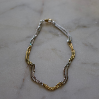 Two Tone Necklace in gold and silver stainless steel, featuring alternating chain links and a polished mixed-metal finish.