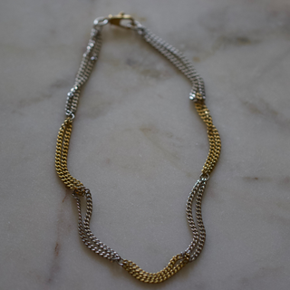 Two Tone Necklace with a gold and silver stainless steel chain and alternating polished sections in a linked design