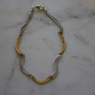 Two Tone Necklace in gold and silver stainless steel, with alternating textured chain sections and a lobster clasp