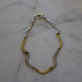 Two Tone Necklace in gold and silver stainless steel, featuring a polished textured chain with alternating metal sections