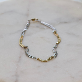 Two Tone Necklace in gold and silver stainless steel, featuring a polished, wavy chain with alternating metal tones