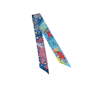 Wander Wild Twilly scarf with vivid blue silky fabric, colorful woodland animals, botanical motifs, and star prints on both sides