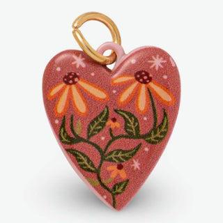 Wildflower Heart Charm with a pink heart-shaped body, colorful floral artwork, and a gold-tone metal clasp