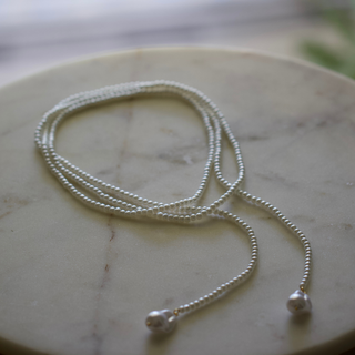 Wrap Pearl Lariat Necklace in silver-tone metal with a long fine chain and two pearl-tipped ends