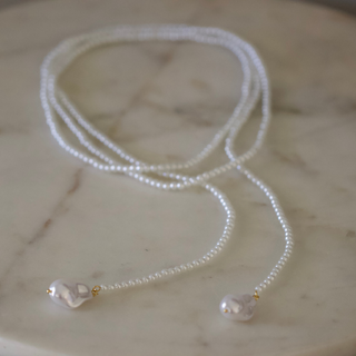 Wrap Pearl Lariat Necklace with delicate white glass pearl strands and larger irregular pearl drops finished with gold-tone beads
